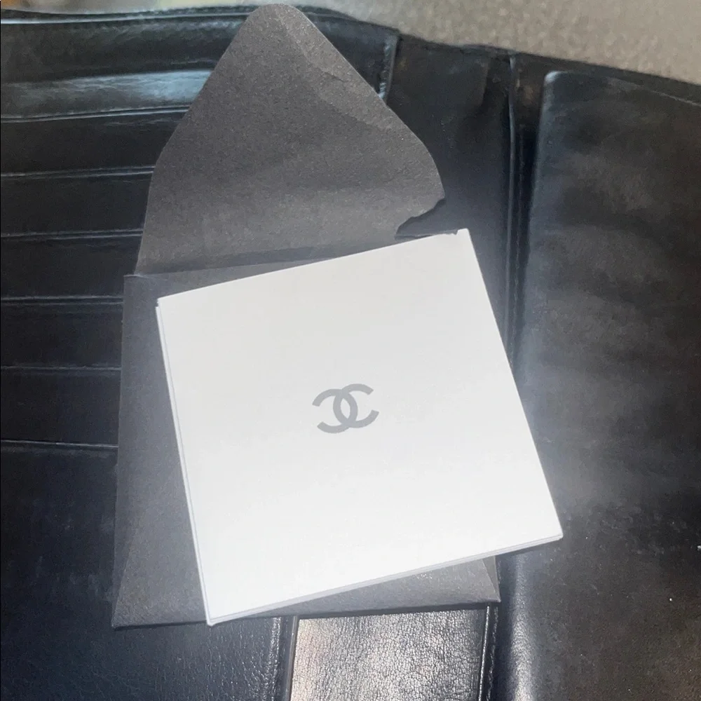 CHANEL Textured Black Caviar Leather Kisslock Wallet CC logo embossed